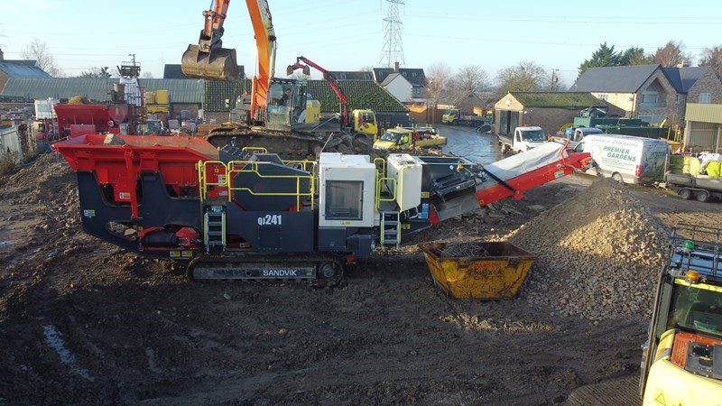 Sandvik mobile jaw crusher at quarry site.